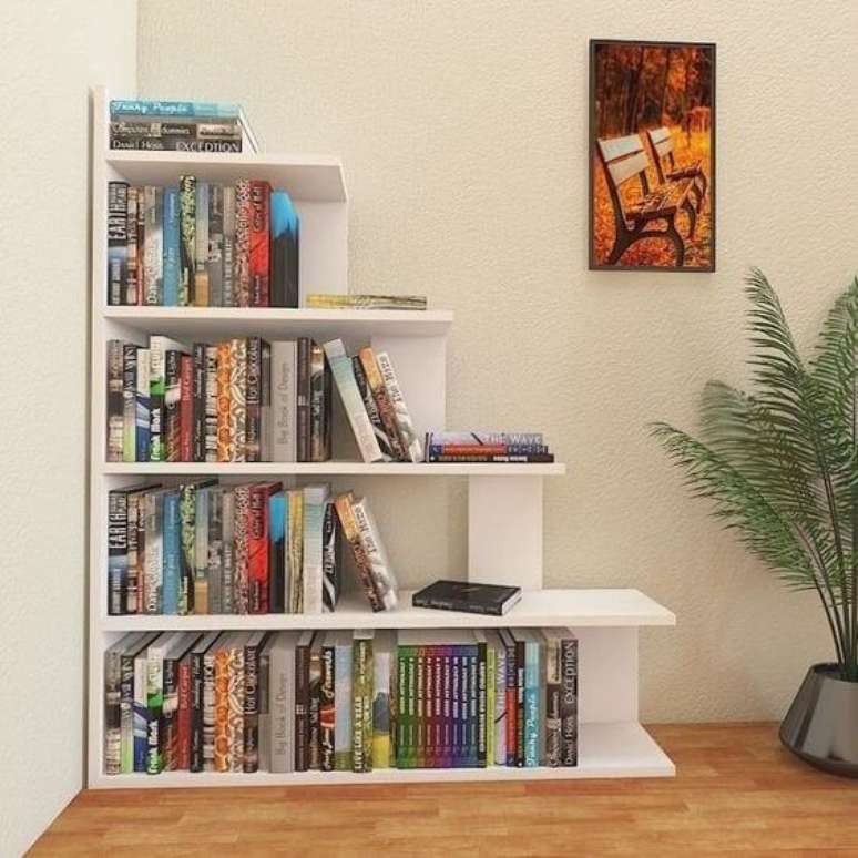 14. Mini estante de canto para livros na sala – Foto Nichos Decorações