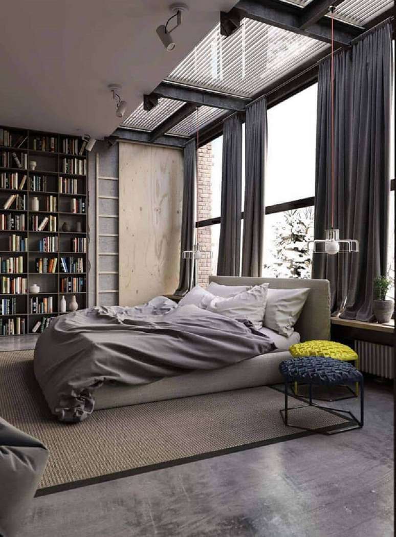 31. Estilo industrial para quarto grande decorado com estante de livros – Foto: Lagom Studio