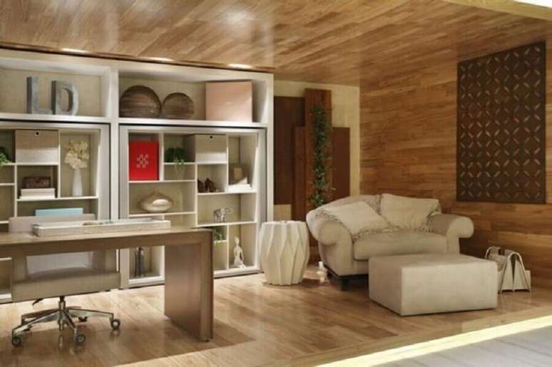 34. Decora&ccedil;&atilde;o sofisticada para escrit&oacute;rio com poltrona namoradeira com descanso para os p&eacute;s &ndash; Foto: Leila Dion&iacute;zio