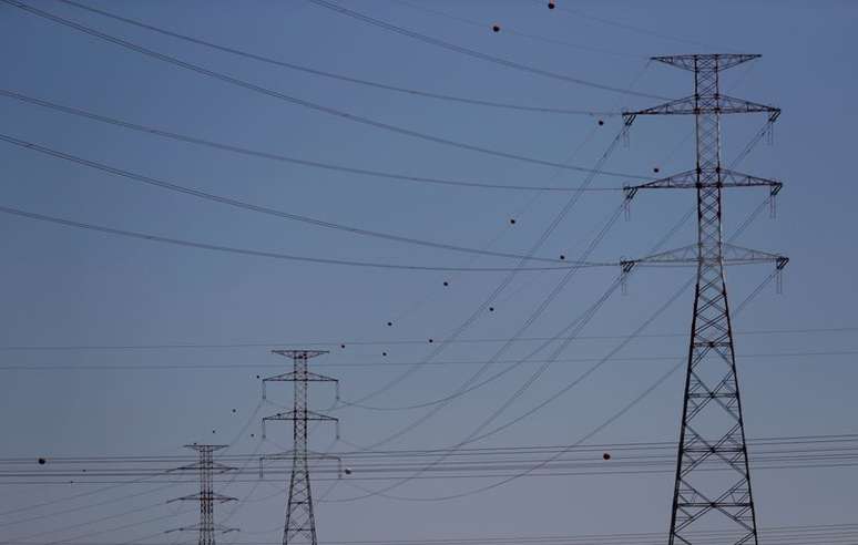 FILE PHOTO: Electric power cables are seen near an Energias de Portugal (EDP) power plant on the outskirts of Carregado, Portugal May 16, 2018. REUTERS/Rafael Marchante/File Photo