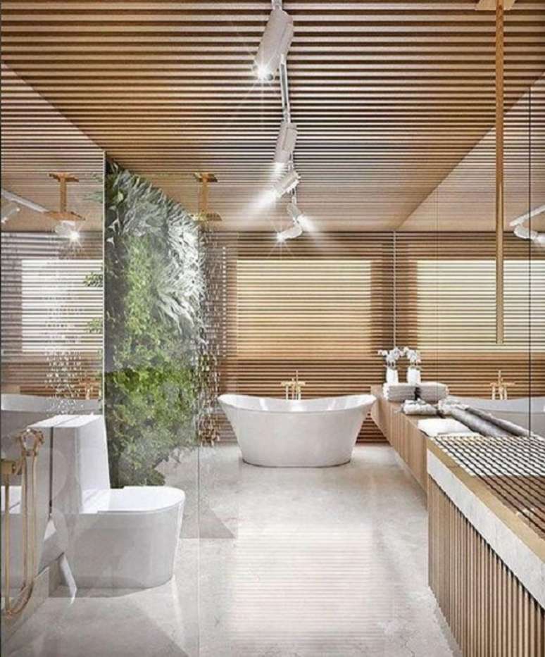 51. Jardim vertical para decoração de banheiro de luxo grande com banheira de imersão – Foto: Dicas de Mulher