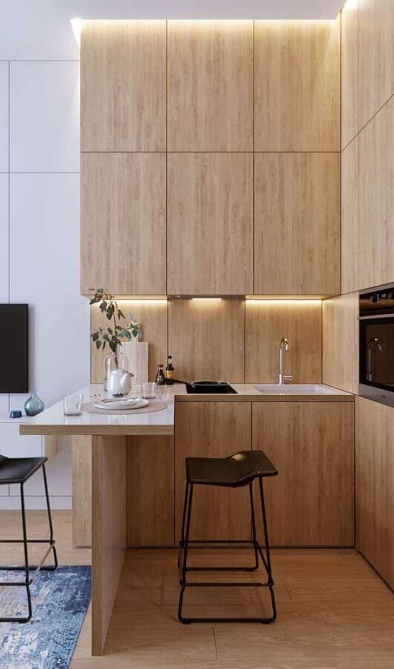 58. Móveis planejados para decoração de cozinha estilo americana pequena amadeirada – Foto: Apartment Therapy