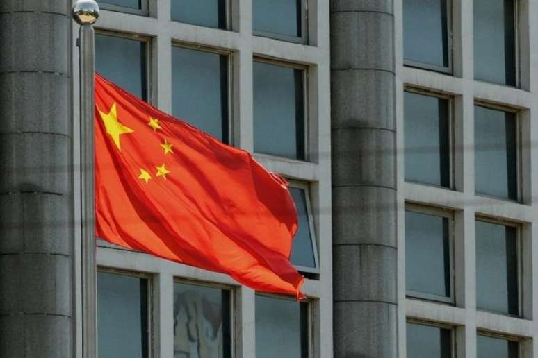 Bandeira da China não é única chinesa no pódio (Foto: STR / AFP / CP)