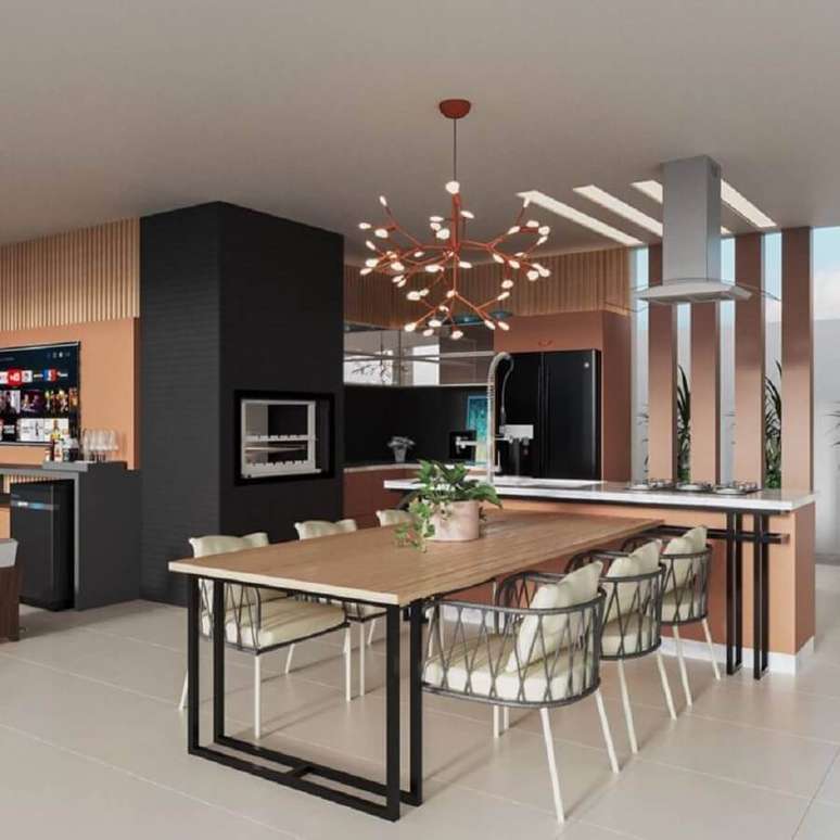 5. Decora&ccedil;&atilde;o moderna com lustre para &aacute;rea gourmet planejada com detalhes sofisticados &ndash; Foto: Jeito de Casa