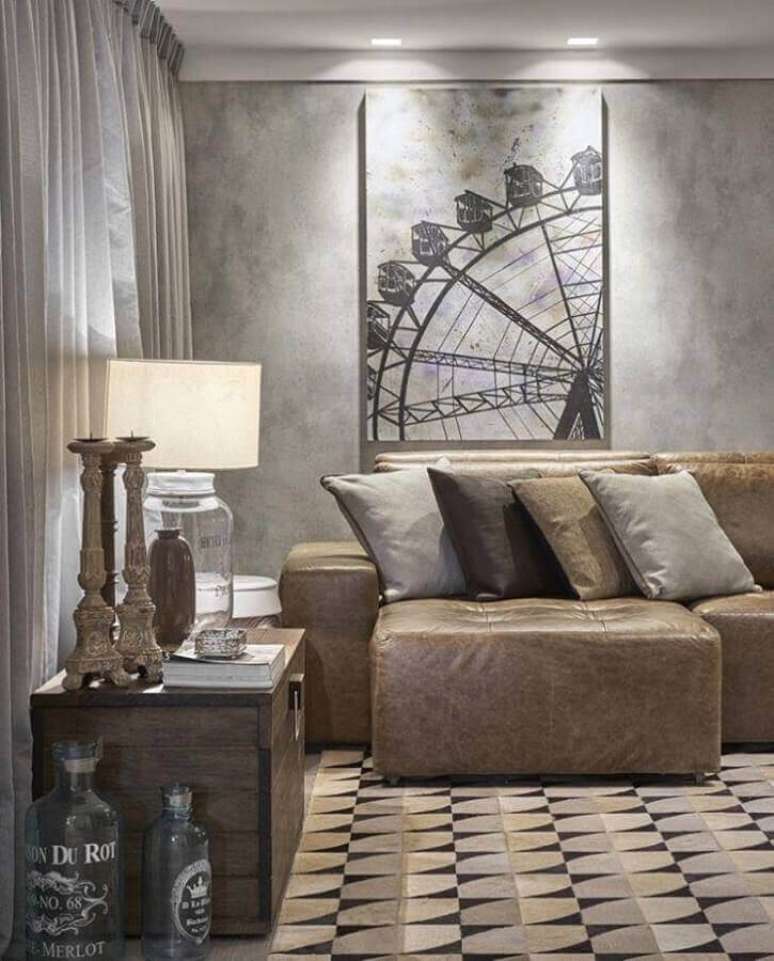 24. Tipos de sofá de couro retrátil para decoração de sala com parede de cimento queimado – Foto: Líder Interiores