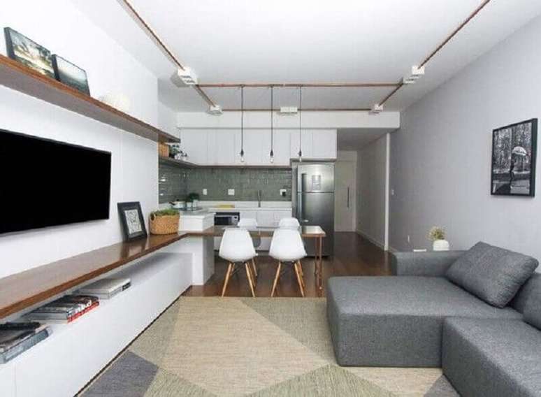 58. Tapete geométrico para decoração de sala de estar e jantar integrada – Foto: SP Estúdio