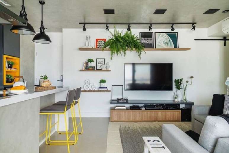 22. Cimento queimado para decora&ccedil;&atilde;o de sala e cozinha americana &ndash; Foto: SP Est&uacute;dio Arquitetura