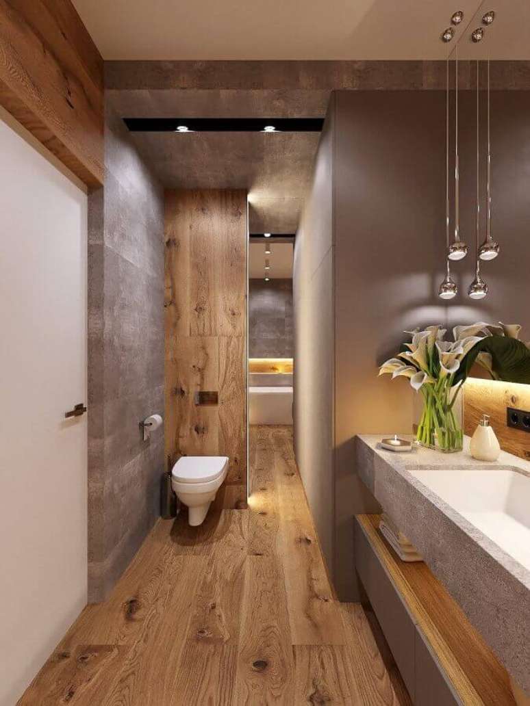 35. Decoração moderna com cimento queimado para banheiro com piso de madeira – Foto: Behance