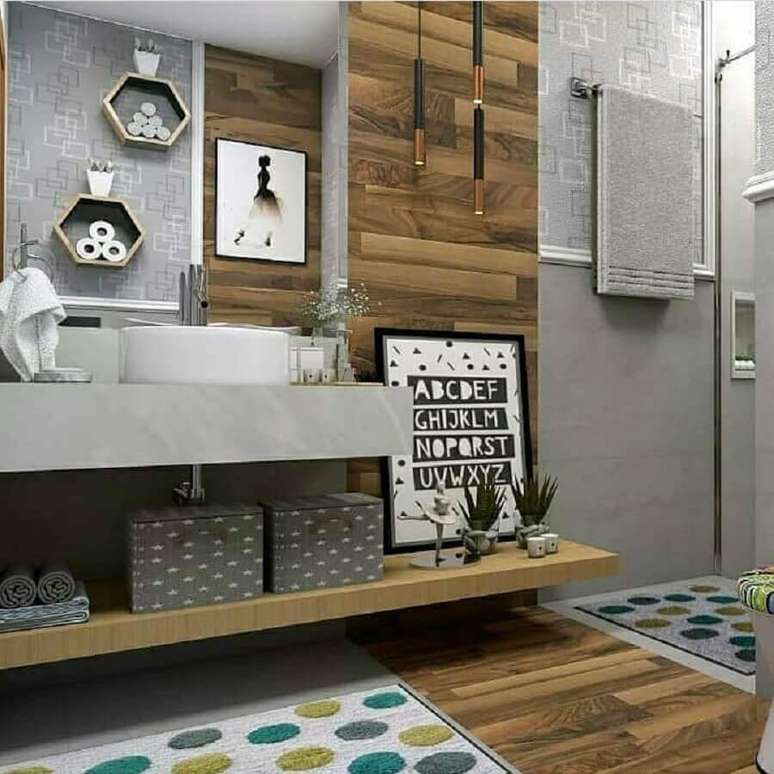 40. Decoração moderna para banheiro com piso de madeira e bancada de cimento queimado – Foto: Dicas Decor