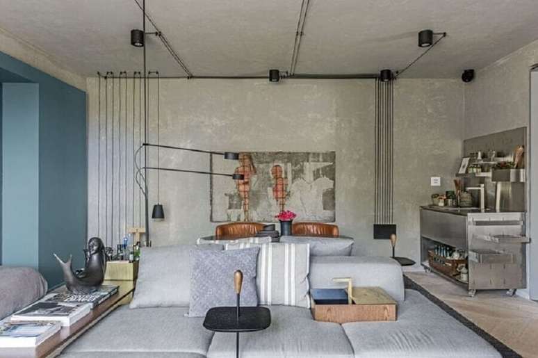 3. Cores de casas modernas para sala estilo industrial decorada com parede azul e parede de cimento queimado &ndash; Foto: Triart Arquitetura