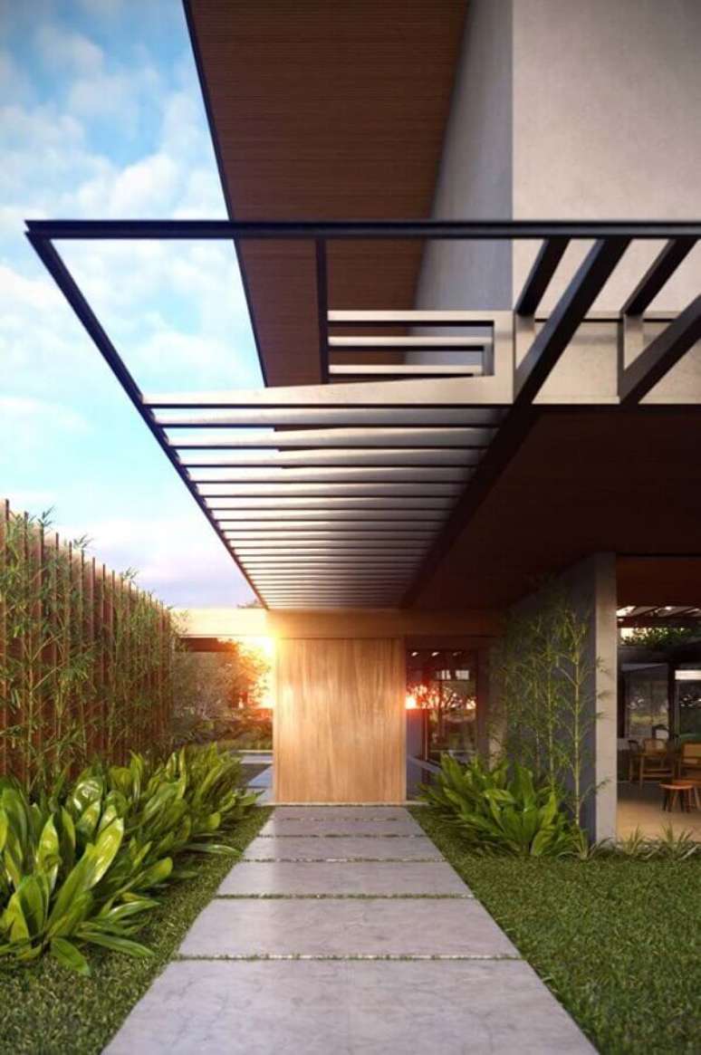 27. Cores de casas modernas externas com fachada de cimento queimado com madeira – Foto: Futurist Architecture