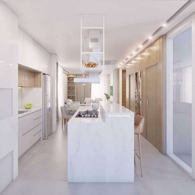 59. Ilha gourmet com cooktop para decoração de cozinha branca planejada – Foto: Incomum Arquitetura Singular