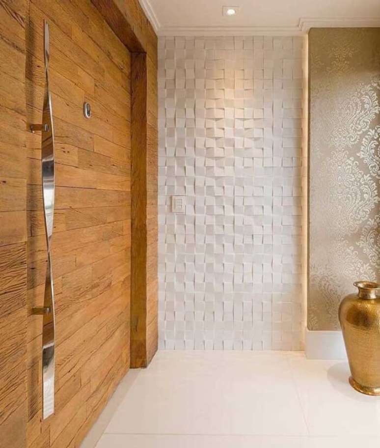 44. Hall de entrada mescla madeira com parede de placa de gesso 3D. Fonte: Jorge Mafort Vieira