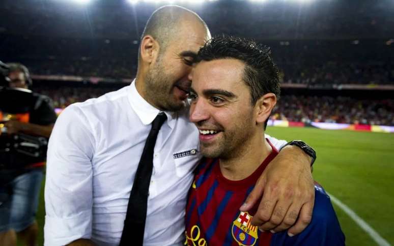 Guardiola e Xavi foram multicampeões juntos no Barcelona (Foto: Divulgação / Site oficial do Barcelona)