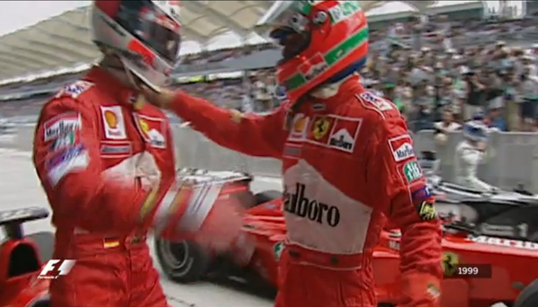 Michael Schumacher e Eddie Irvine comemorando a vitória na Malásia