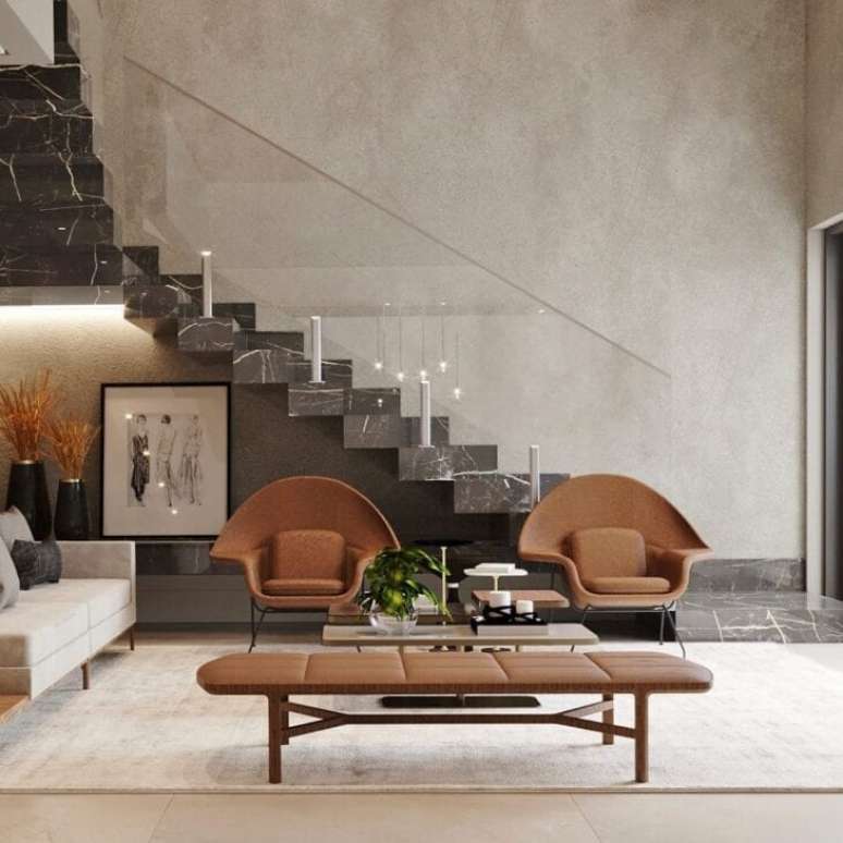 21. Escadas modernas de mármore preto com poltrona marrom – Foto Elayne Felix