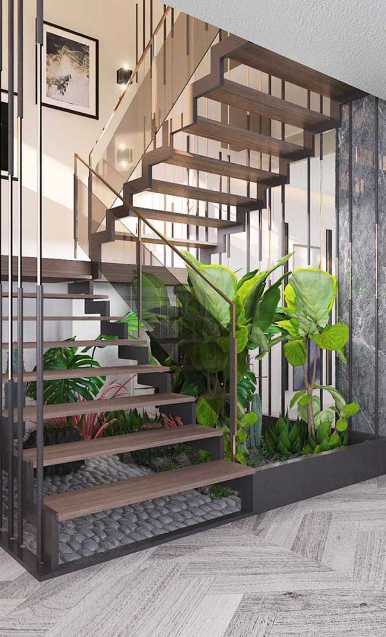 69. Escadas modernas de ferro e madeira decorada com plantas – Foto Decor Fail