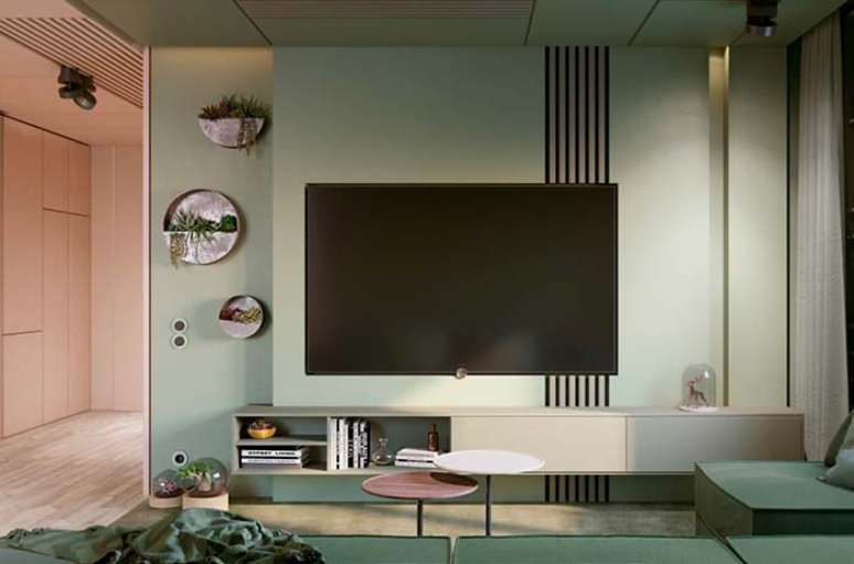 31. Sala com painel verde pastel e decoração minimalista – Foto Decor Facil
