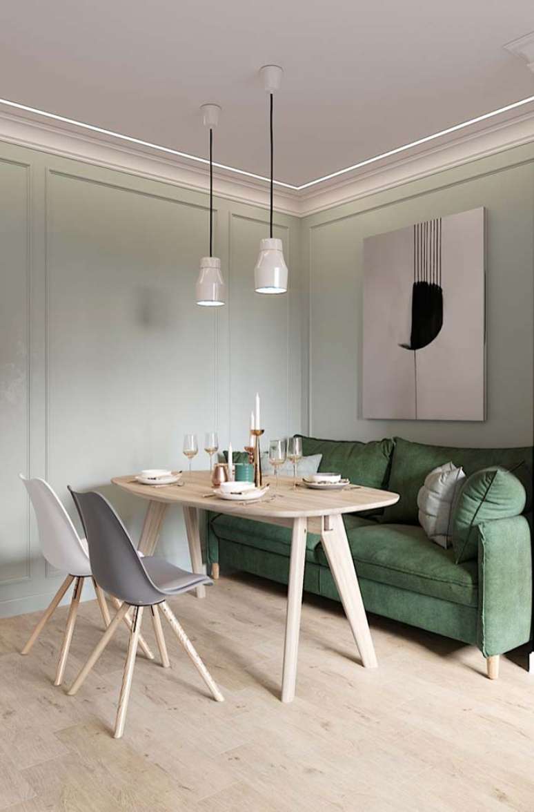 37. Sala de jantar com parede verde pastel e sofá verde escuro – Foto Decor Facil