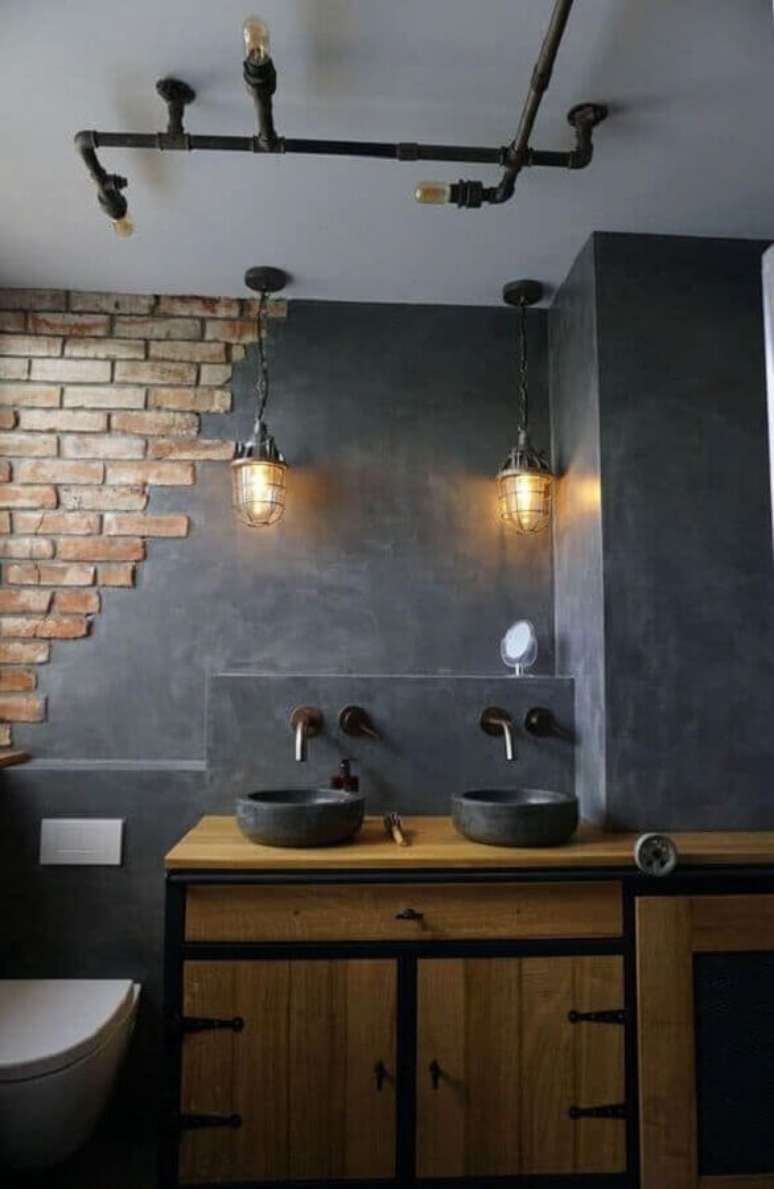 41. Parede de cimento queimado com detalhe em tijolinho para decoração de banheiro industrial – Foto: Home Designing