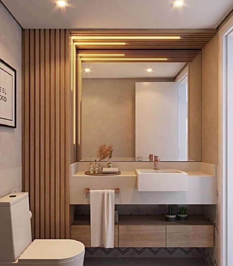 17. Decora&ccedil;&atilde;o de lavabo planejado com parede ripada de madeira &ndash; Foto: Yan Oliveira e Igor Oliveira