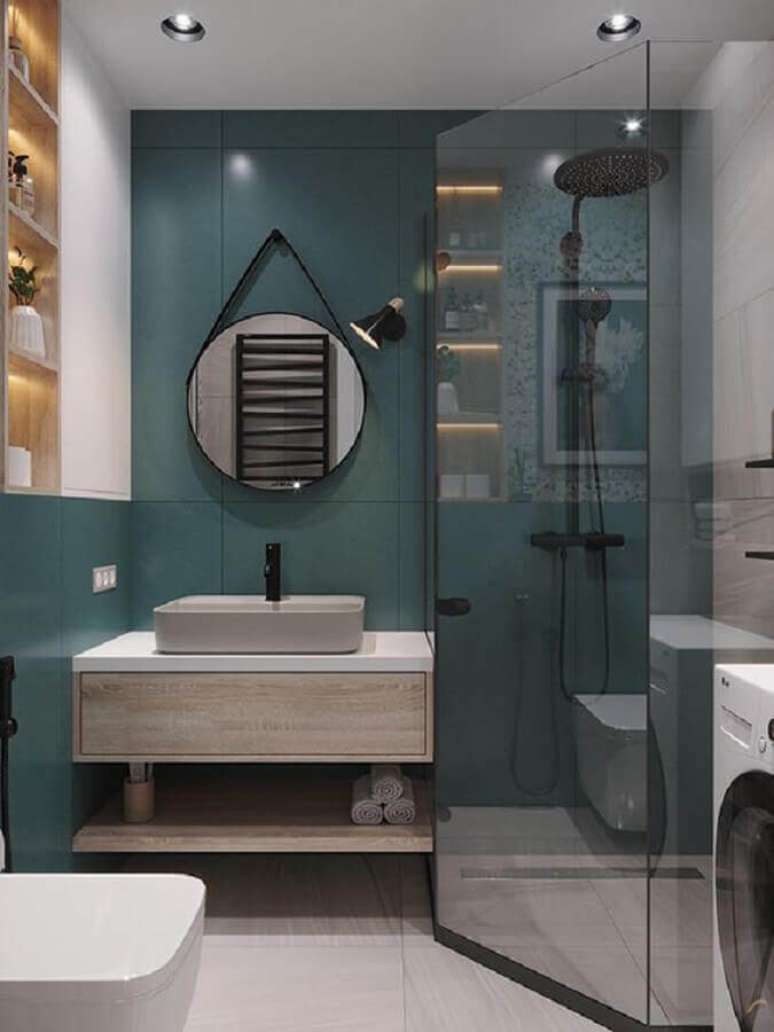 42. Decoração moderna de banheiro verde com nichos de madeira embutidos – Foto: Behance