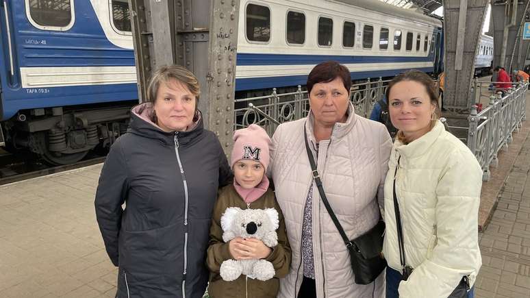 Iryna, far right, says she is telling her daughter Katerina, second from left, the truth about what's happening