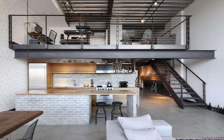 1. Decoração moderna de loft estilo industrial com mezanino de ferro – Foto: Loft – Blog Bridge Imóveis