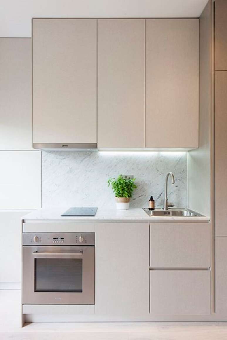 58. Cozinha clean com móveis bege claro – Foto Lusso Architects