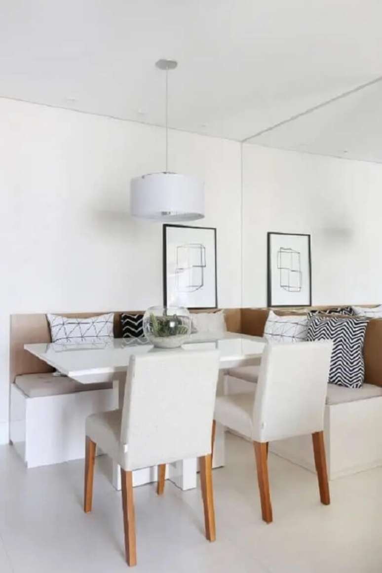 11. Sala de jantar minimalista com canto alem&atilde;o com ba&uacute;. Fonte: Bianchi Lima