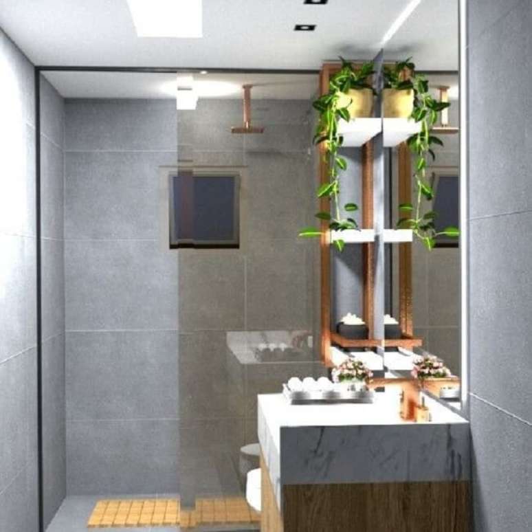 73. Banheiro com bancada planejada e chuveiro de teto. Fonte: Danilo Feitosa