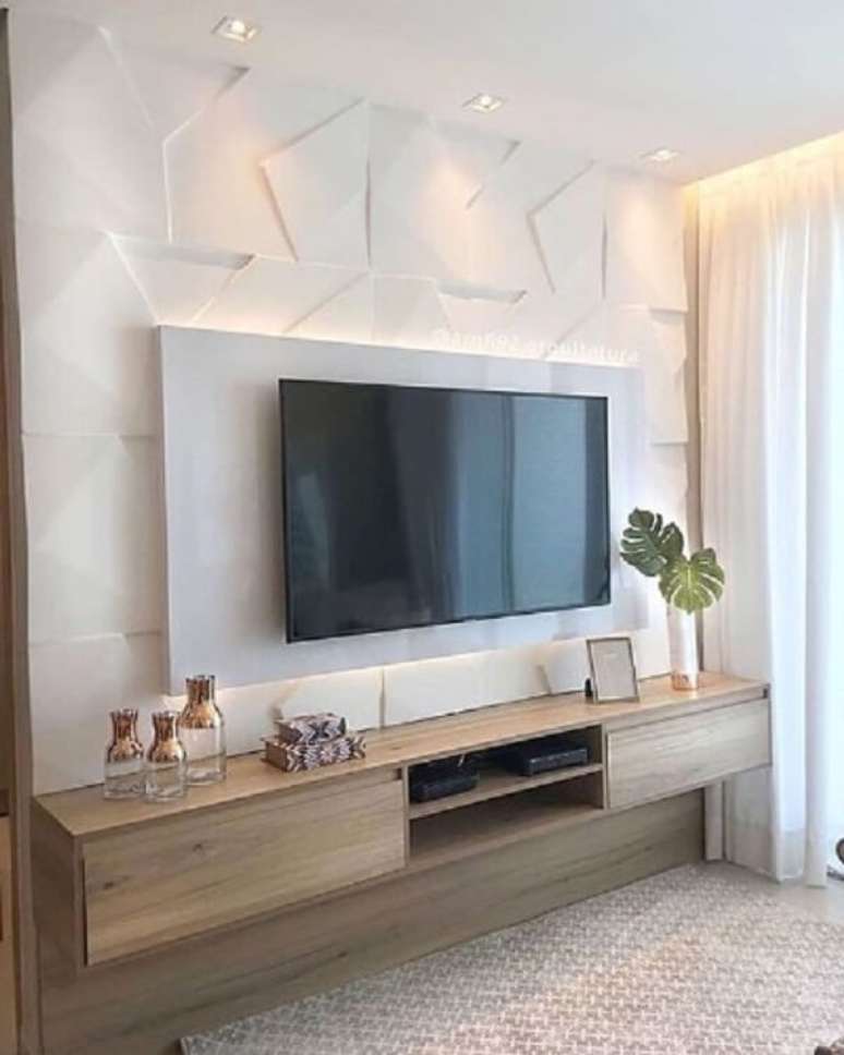 49. Rack de madeira e painel de gesso para sala de tv. Fonte: Maria Fernanda Arquitetura