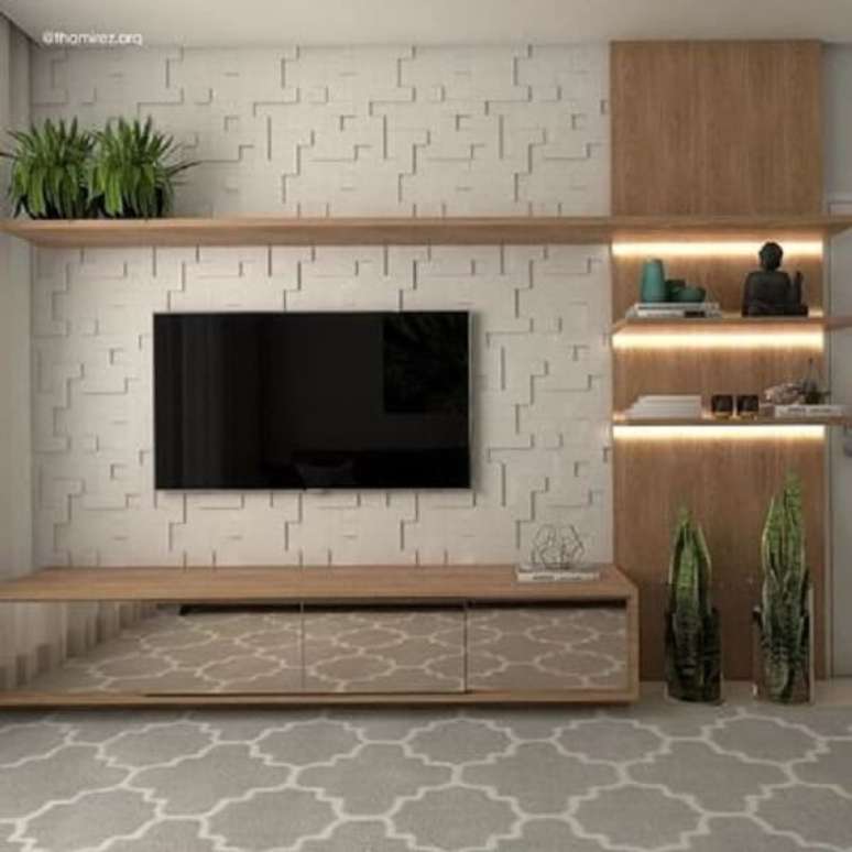 33. M&oacute;veis espelhados e painel de gesso para sala de tv. Fonte: Projetos Criativos