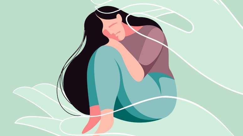 El dibujo de una mujer es apoyado en sus pies, sentado. 