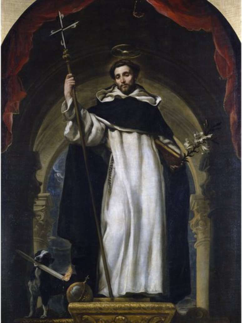 S&atilde;o Domingos de Gusm&atilde;o, representado ao lado de um cachorro carregando uma tocha