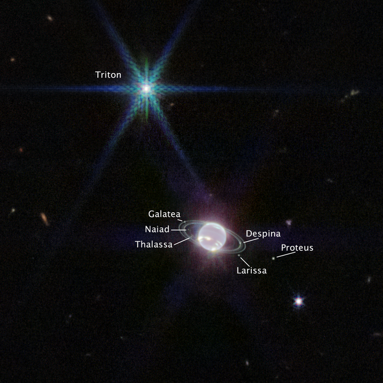 A lua Tritão aparece como o ponto de luz mais brilhante da imagem