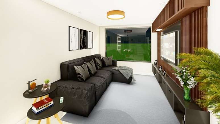 28. Sala de tv com sofá chaise preto – Foto Bianca Melo