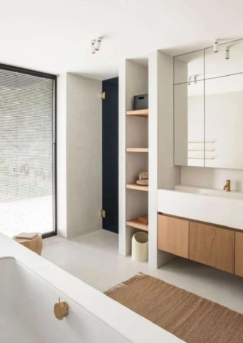 62. Banheiro planejado e decorado com cimento queimado branco. Fonte – Juma Architects