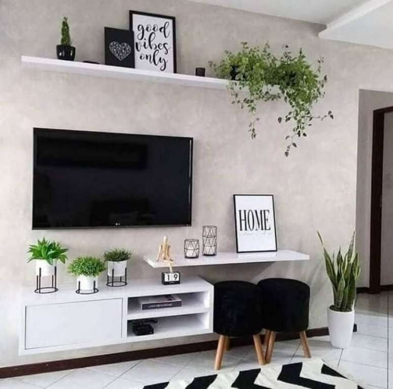 19. Os vasos de plantas trazem um toque verde para a sala com cimento queimado branco. Fonte – Amaisd