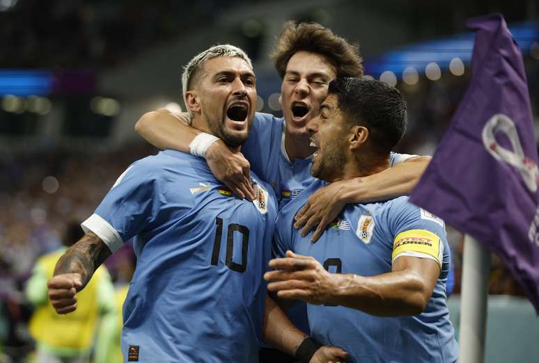 Uruguay's Giorgian de Arrascaeta celebrates scoring their first goal with teammates