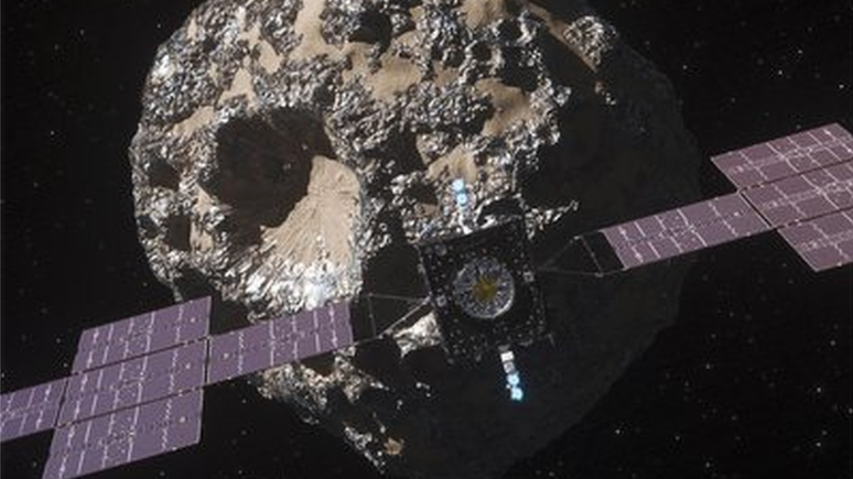 Impressão artística da sonda Psyche da Nasa se aproximando do asteroide 16 Psych