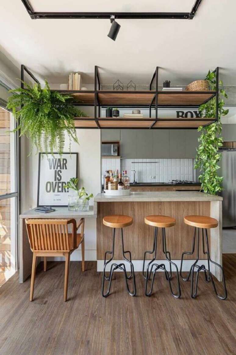 24. Decoração de cozinha americana com prateleira suspensa – Foto: Box14 Arquitetura