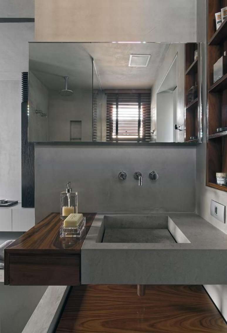 54. Lavabo moderno e chique em tons de cimento queimado e madeira &ndash; Foto Diego Revollo