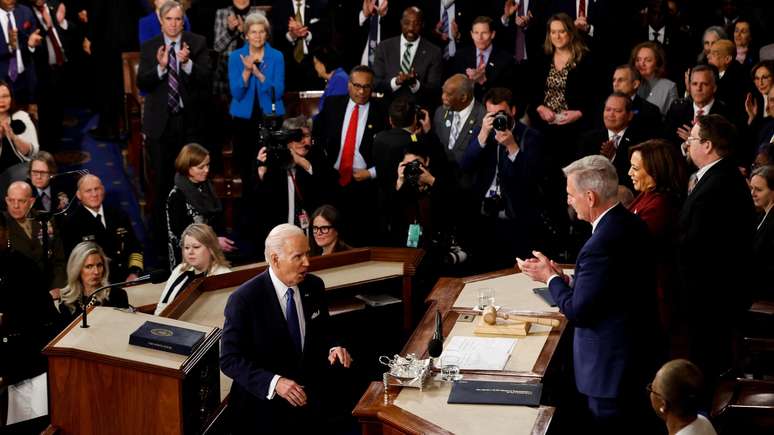 Biden watched by several lawmakers, some applauding