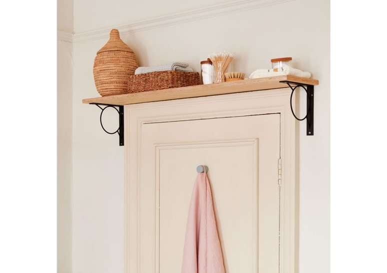 Put a shelf above the bathroom door.