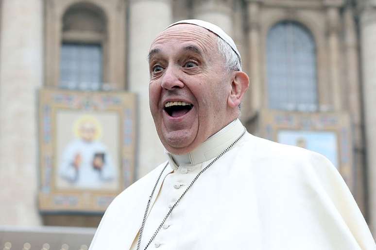 Speaking of Brazil, Pope Francis smiles and sings the Carnival song;  clock