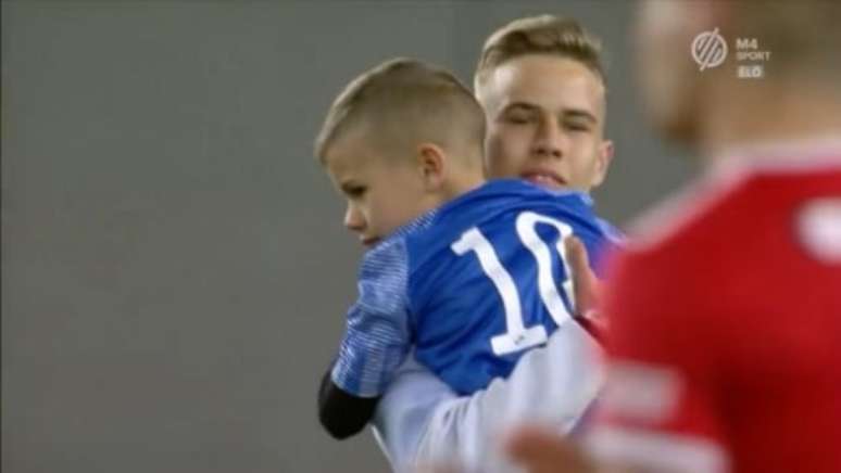 The goalkeeper prevents a child from scoring twice and gets booed during half-time;  see the movie