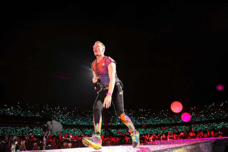 Chris Martin says glow bracelets are “too expensive” and is asking fans to return them