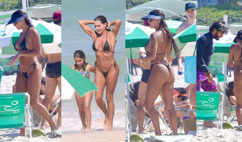 Black PP bikini and nothing basic!  Deborah Secco enhances her tan in a thong look with husband and daughter at the beach