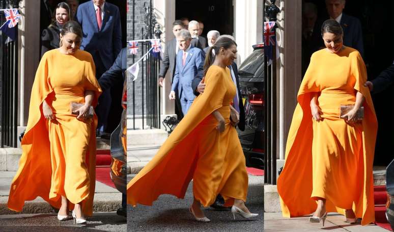 Janja chooses a long orange dress with a cape at an event with Lula before the coronation of King Charles III.  I wait!